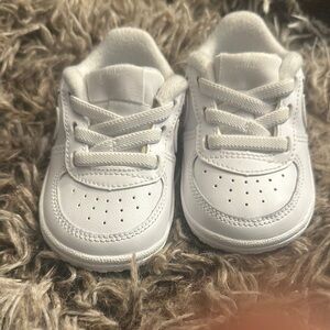 Nike White Sneakers with Durable Rubber Sole and Smooth Upper